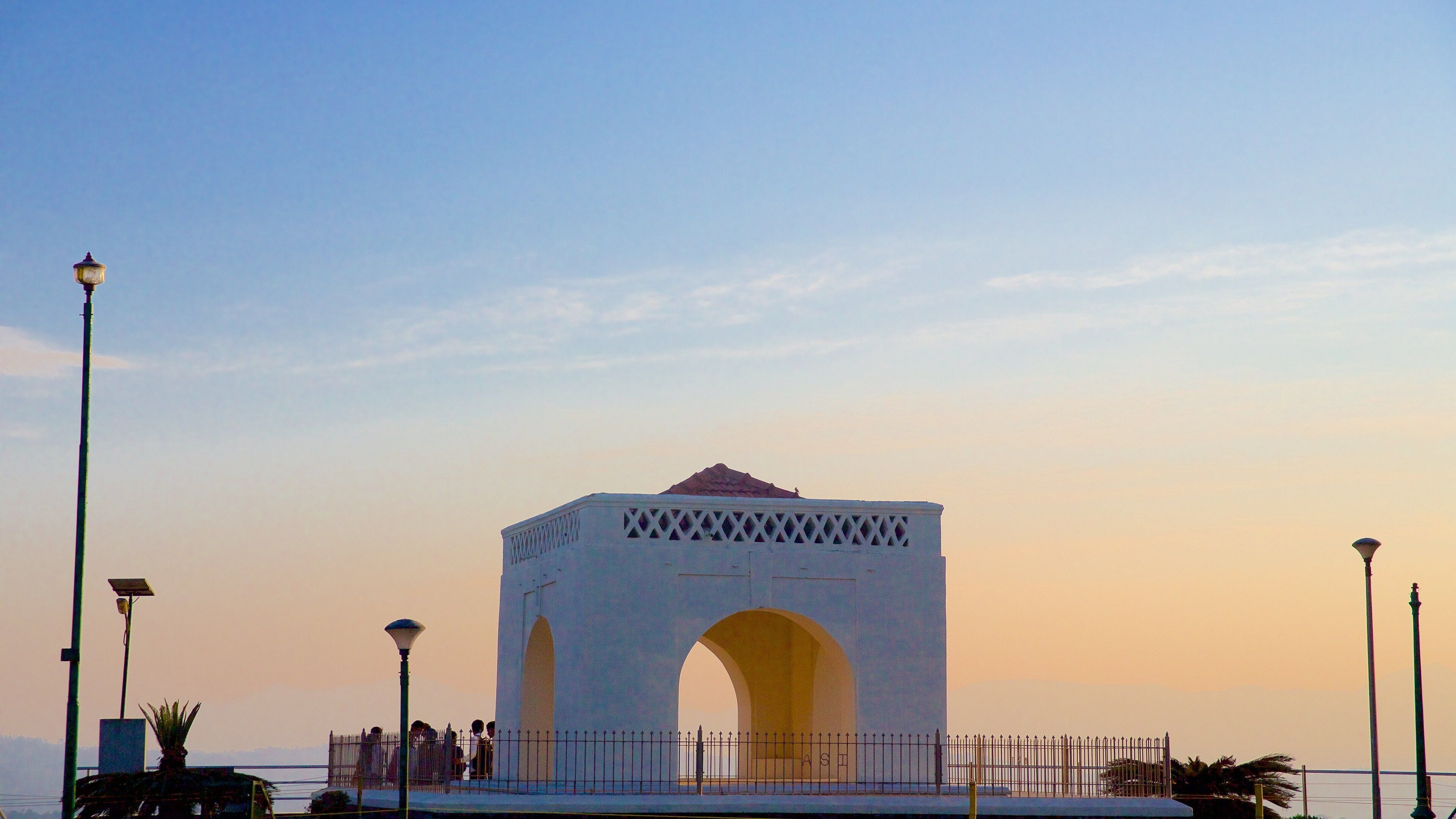 Raja\'s Seat featuring a sunset and a monument