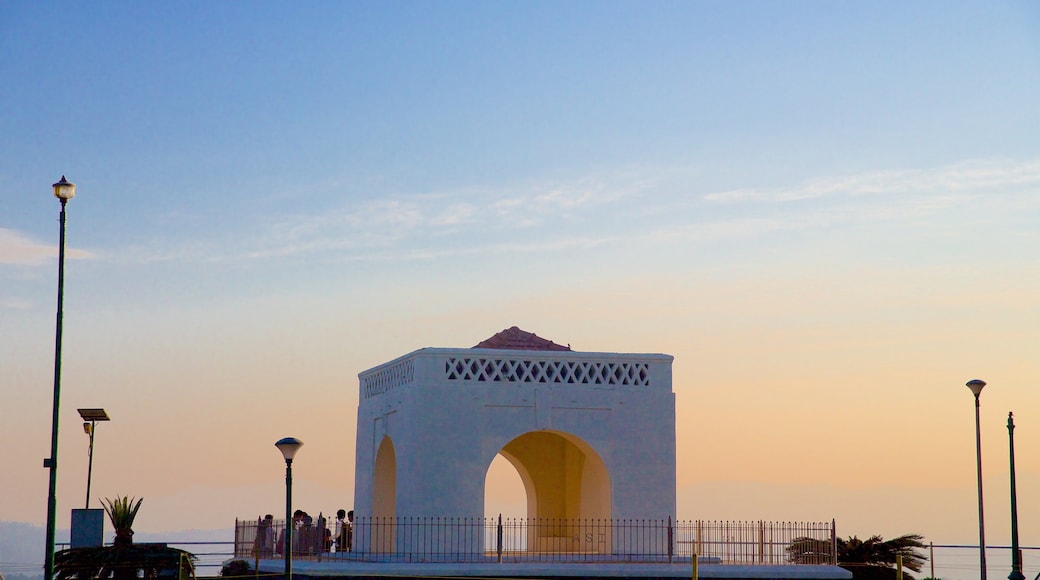 Raja\'s Seat featuring a sunset and a monument