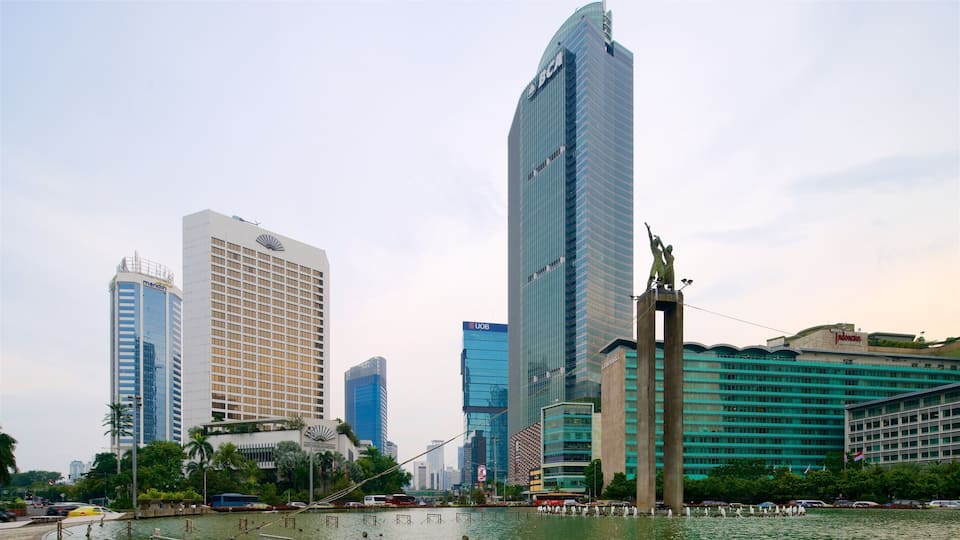 Bundaran Hi showing a skyscraper, a river or creek and a city