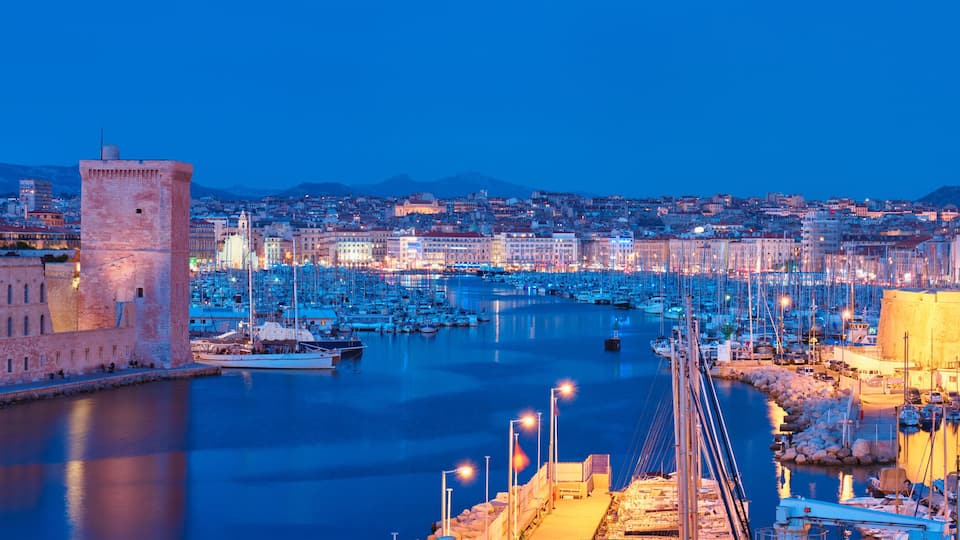 Marseille Old Port and Fort Saint-Jean in night. Marseille, France