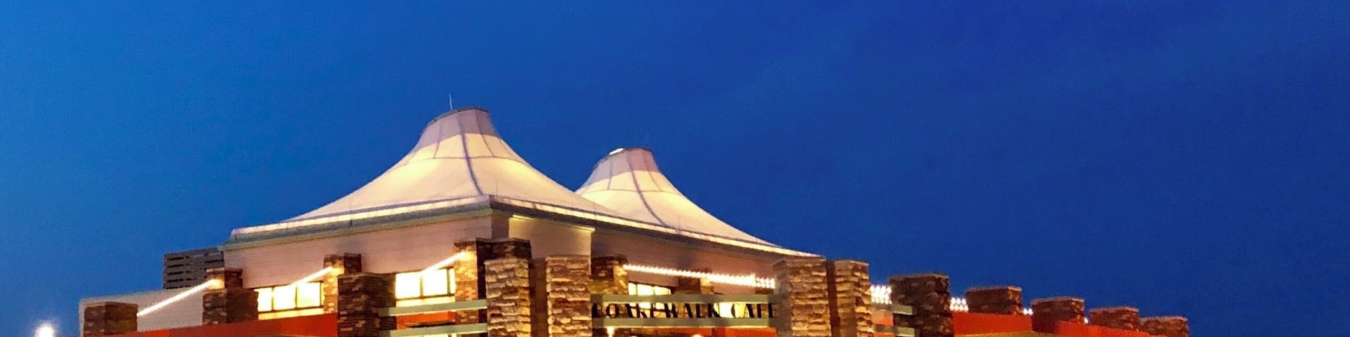 The store which is lining the side of the boardwalk in Jones Beach, built few years ago, now is getting popular and crowded in summer. The convenient services of the store not only regale people with enjoyment at the beach, but the structure of the building is also an attractive modern art. During the night time, with the glittering LEDs surrounding the building emit brilliant golden makes the store resplendent.