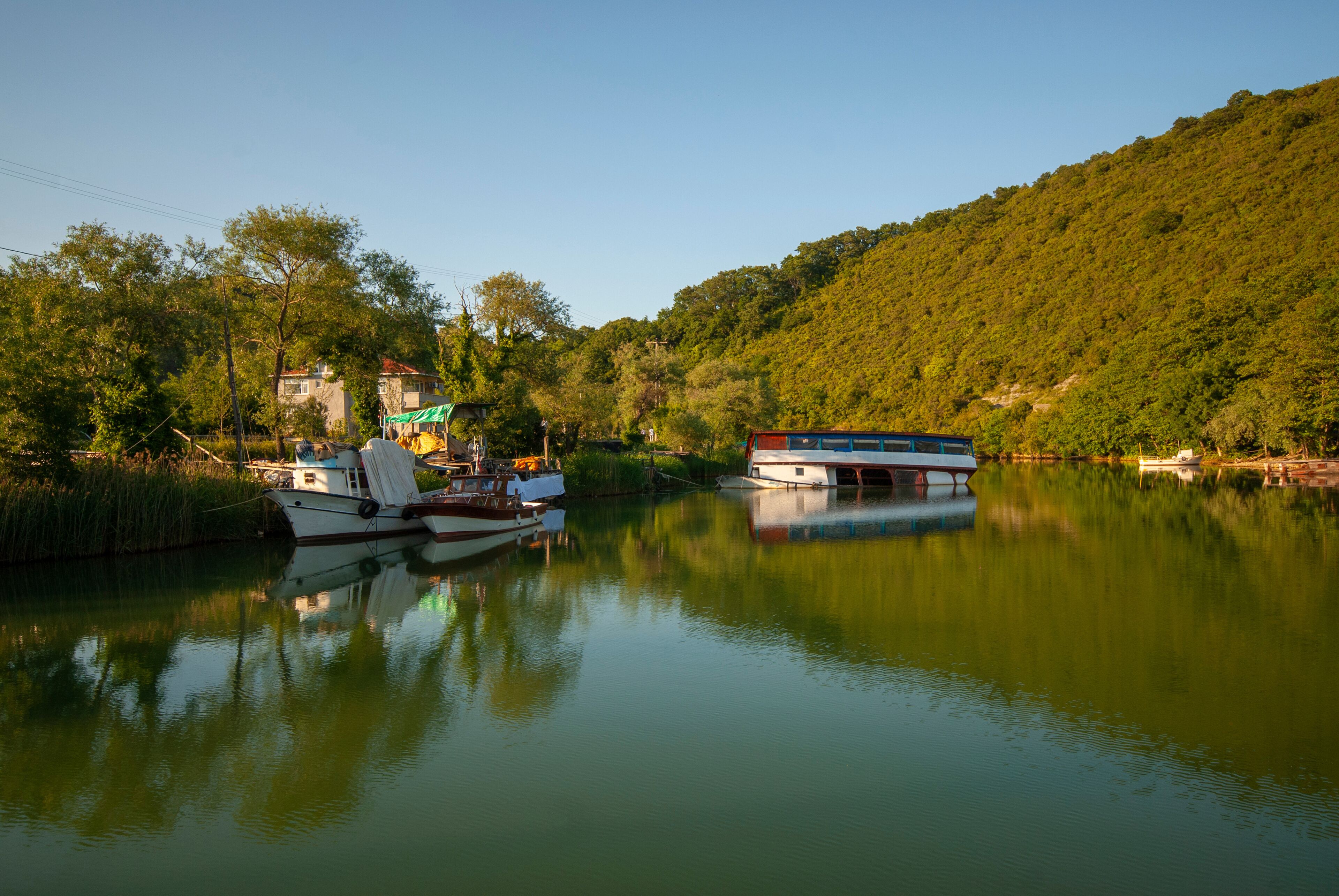 Agva, Sile, Istanbul, Turkey. It's a popular place place and resort destination on Goksu river. Reflection of trees. Reflections in the water.