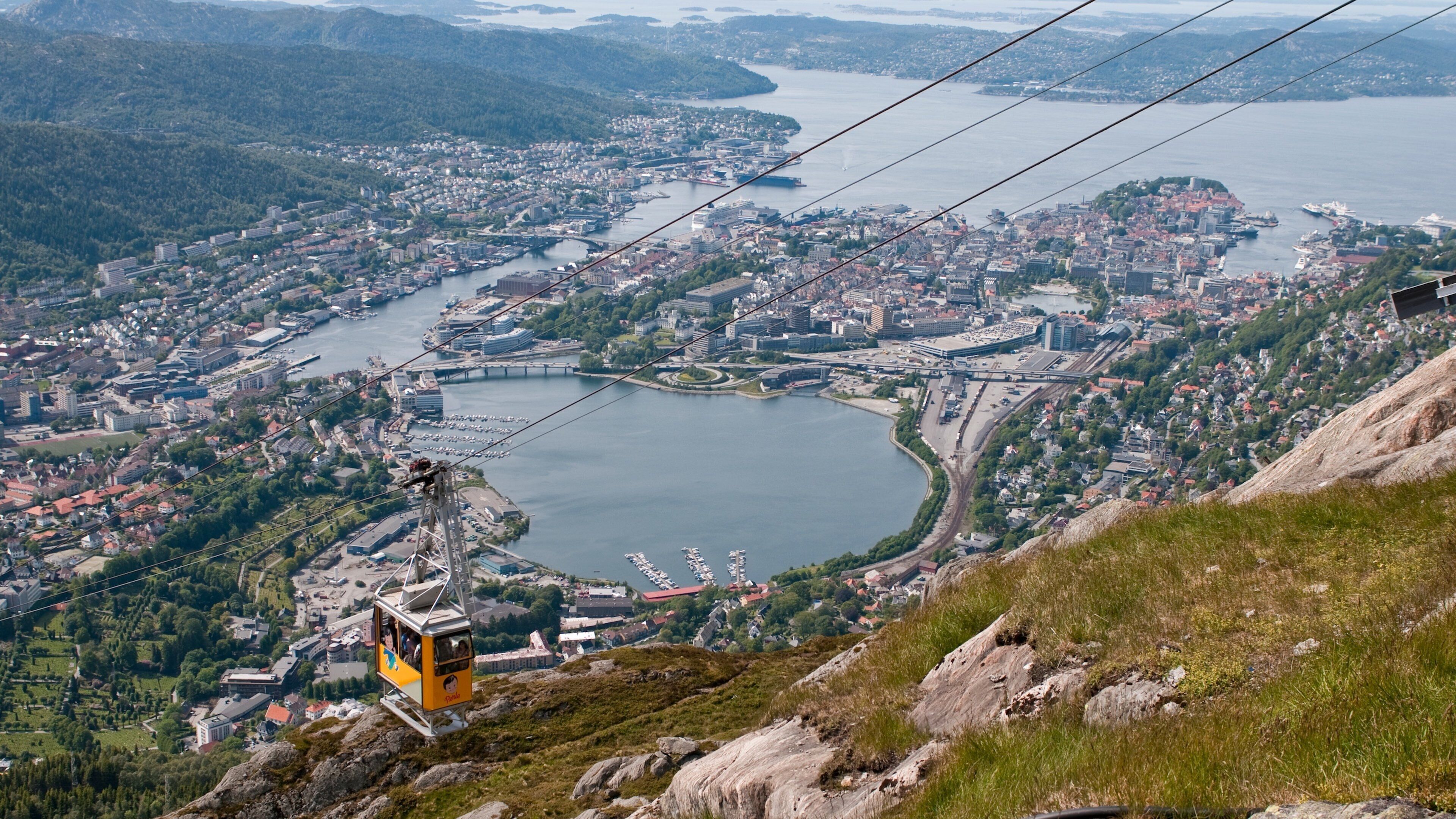 Ulriken Cable Car which includes a bay or harbor, a gondola and a small town or village