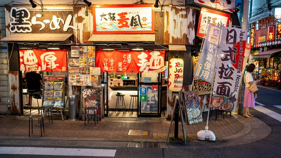 Shinsaibashi which includes street scenes and signage