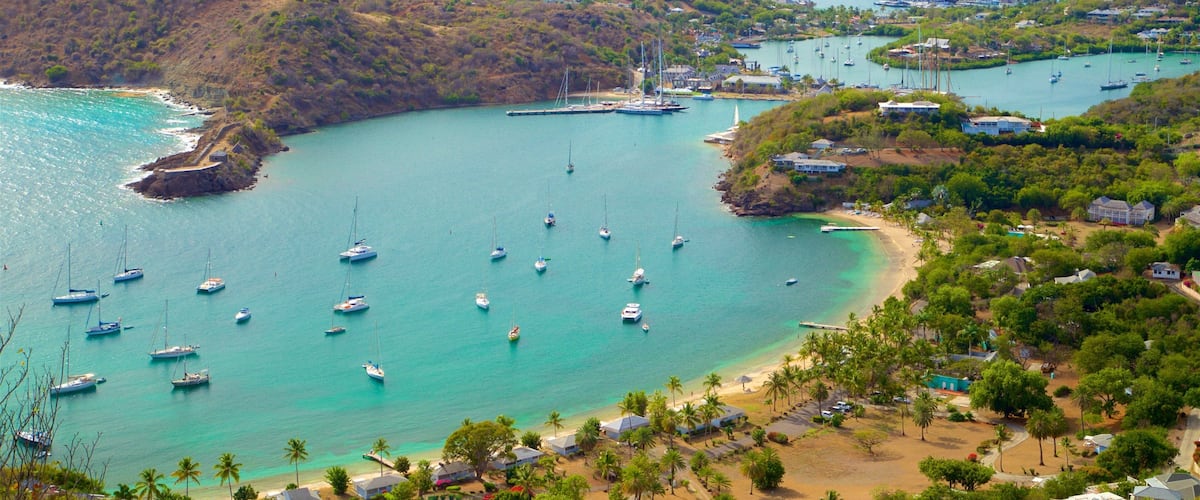 Shirley Heights showing a coastal town, a bay or harbor and island images