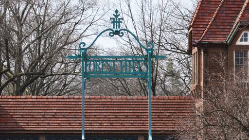 Forest Hills Sign at Queens New York City with Brick Buildings Background