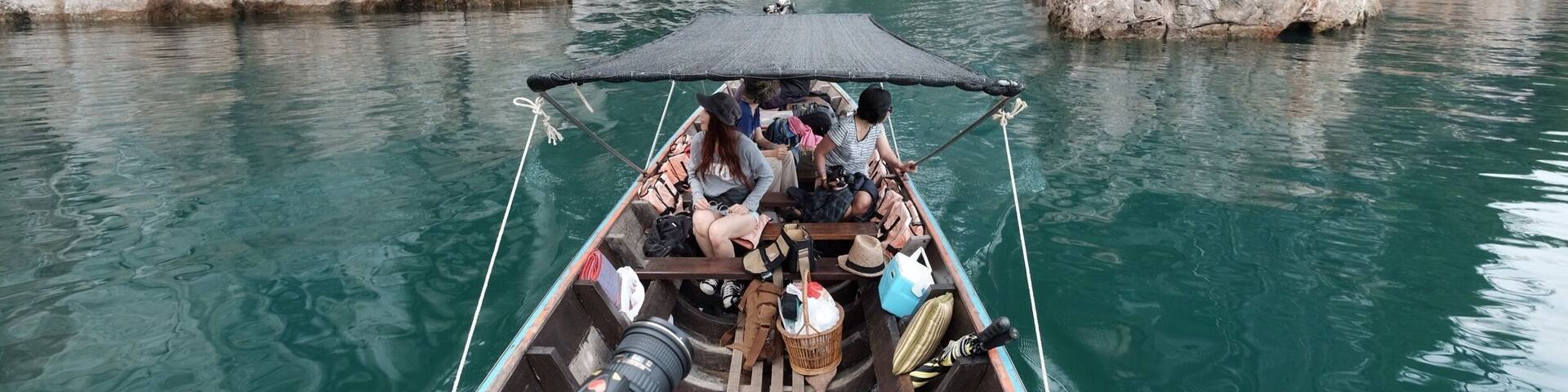 Enjoying the scenery around us in water reserved area at Rachaprapa dam .The color of the water is so green but it's clean and clear!