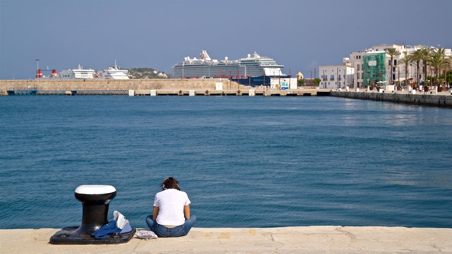 Port of Ibiza showing a bay or harbor as well as an individual femail