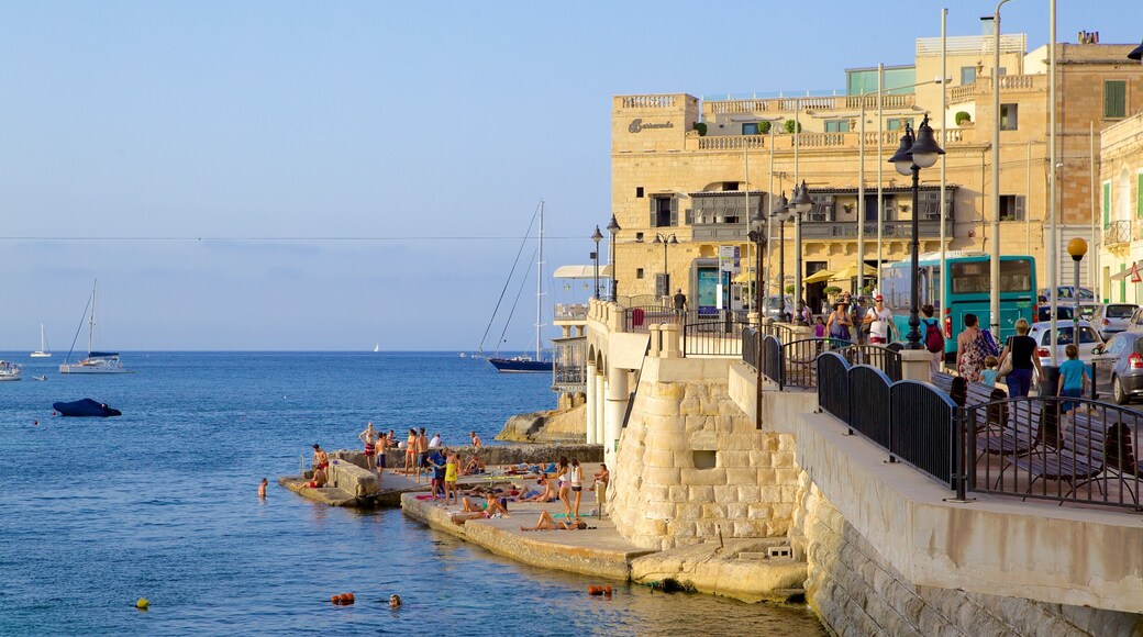 Balluta Bay which includes a bay or harbor, heritage architecture and general coastal views