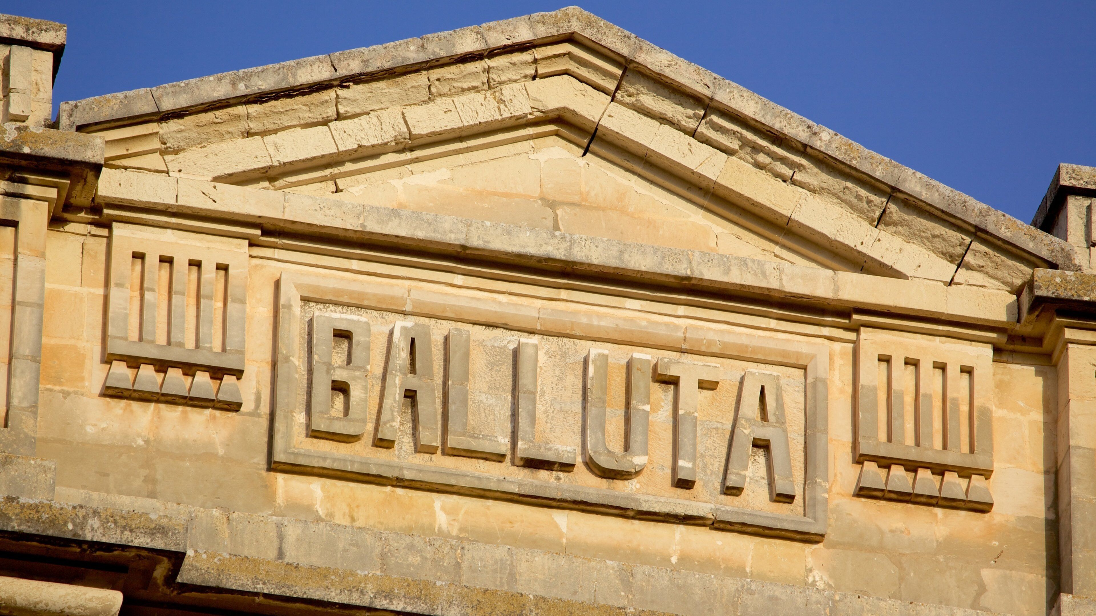 Balluta Bay which includes heritage architecture and signage