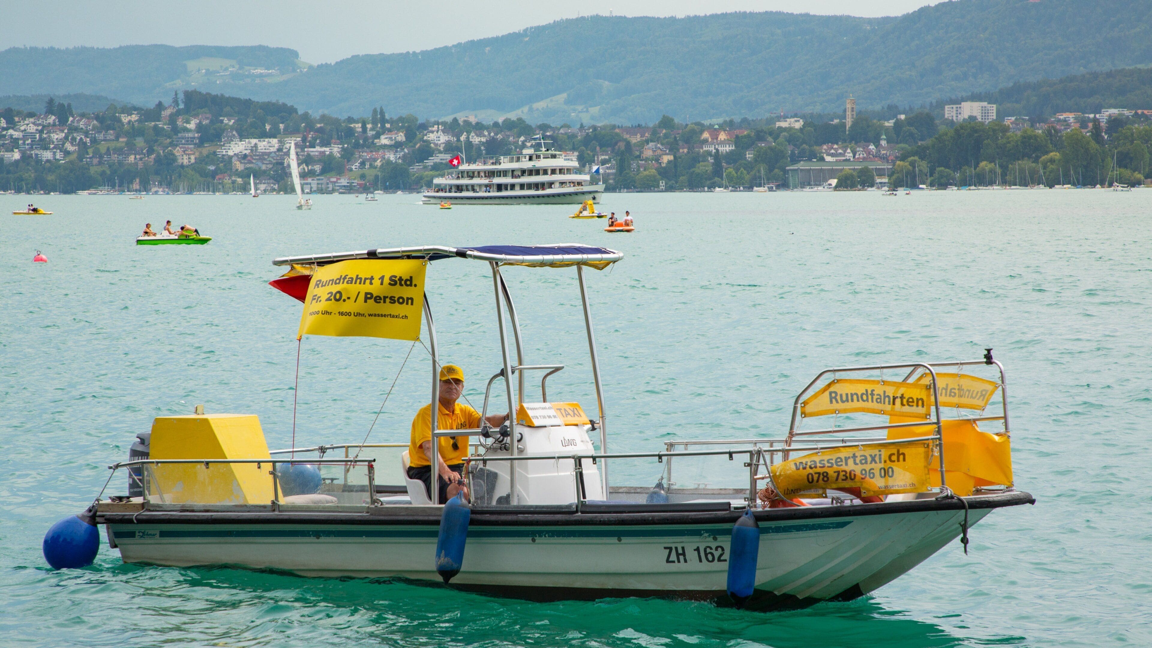 Lakeside Promenade which includes boating and a river or creek as well as an individual male