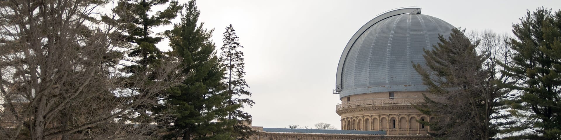 Wide shot of the Yerkes Observatory under cloudy sky in winter in Williams Bay, Wisconsin, USA
