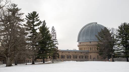 Wide shot of the Yerkes Observatory under cloudy sky in winter in Williams Bay, Wisconsin, USA