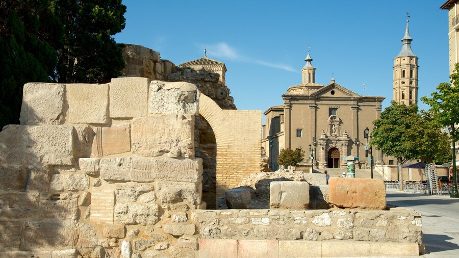 Roman Wall which includes heritage architecture, a church or cathedral and a city