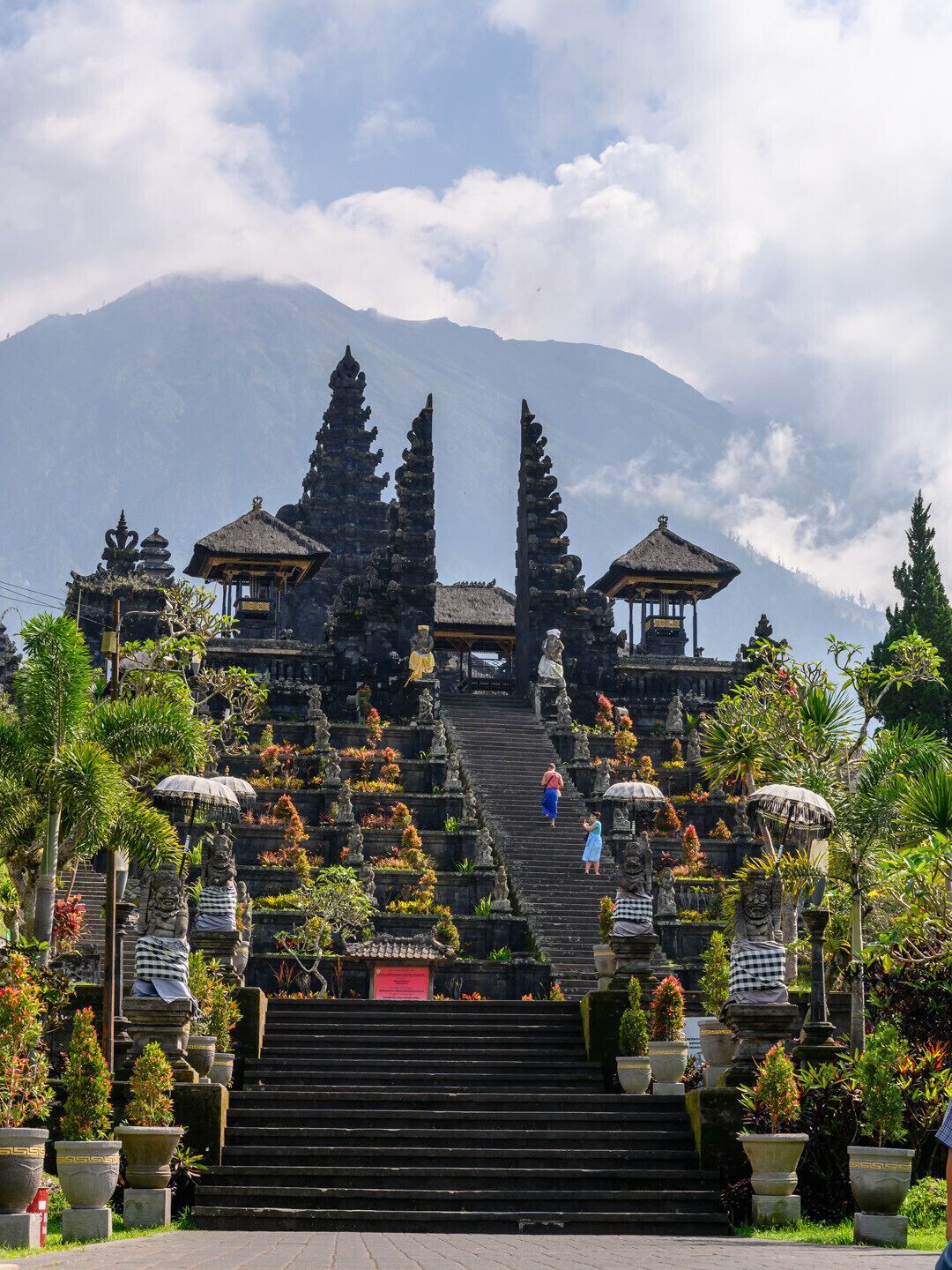 Besakih is known as the Mother Temple of Bali and is the most important temple of the whole island. It is actually more like a complex of temples in one very large compound and its known and loved for is its dramatic location on the southern slopes of Sacred Mount Agung. It is known as and accepted as Bali’s Mother Temple for more than a thousand years. Besakih was hit a few times by earthquakes (e.g. 1917) and also several volcanic eruptions of Mount Agung took their toll, particularly a major one in 1963. The complex did get damaged here and there but in 1963 the the lava flow did pass sparing the temple from complete destruction. This event is now of course part of the overall legend of Pura Besakih. The people believe that the deities showed their true power but without destroying the holy temple completely.

We went here in the early morning to avoid the tourist crowds.

#Indonesia #Bali #Besakih #history #Architecture #Culture
