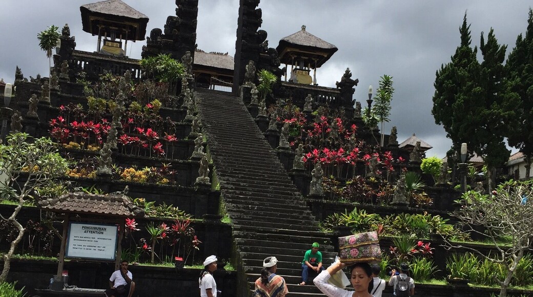 The Mother Temple of Besakih, or Pura Besakih, in the village of Besakih on the slopes of Mount Agung in eastern Bali, Indonesia, is the most important, the largest and holiest temple of Hindu religion in Bali, and one of a series of Balinese temples. Perched nearly 1000 meters up the side of Gunung Agung, it is an extensive complex of 23 separate but related temples with the largest and most important being Pura Penataran Agung. This is built on six levels, terraced up the slope. This entrance is an imposing Candi Bentar (split gateway), and beyond it the even more impressive Kori Agung is the gateway to the second courtyard.
Source: Wikipedia
#architecture