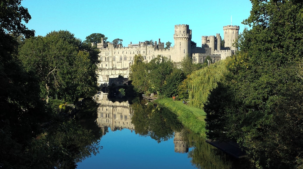 Warwick Castle from the bridge over the River Avon, Warwick, Warwickshire, UK.
