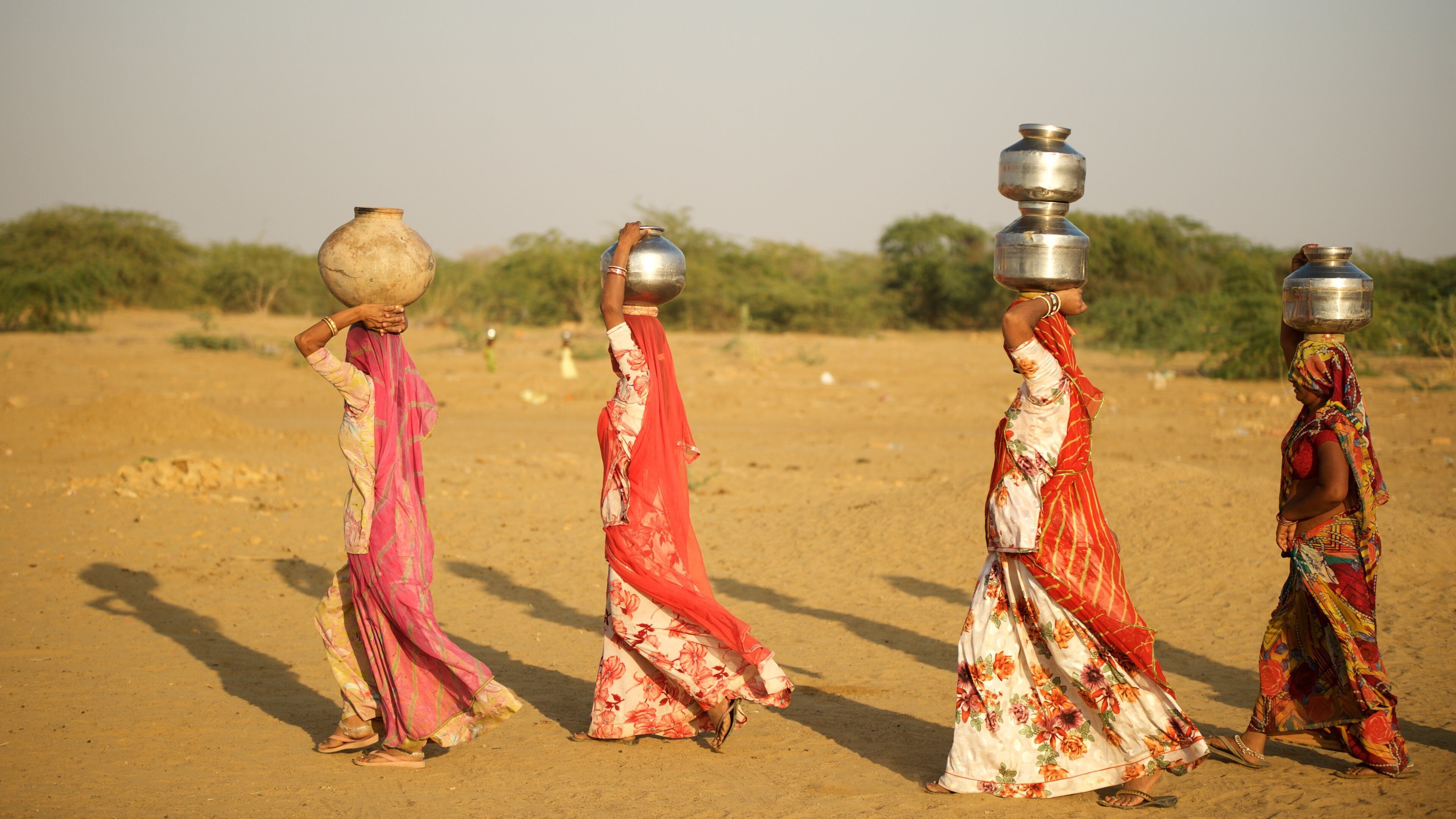 Khuri Sand Dunes which includes desert views as well as a small group of people