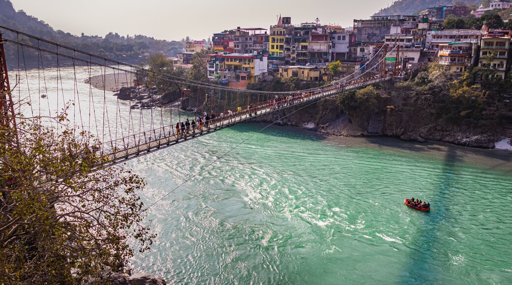 lakshman jhula iron suspension bridge over ganges river from flat angle