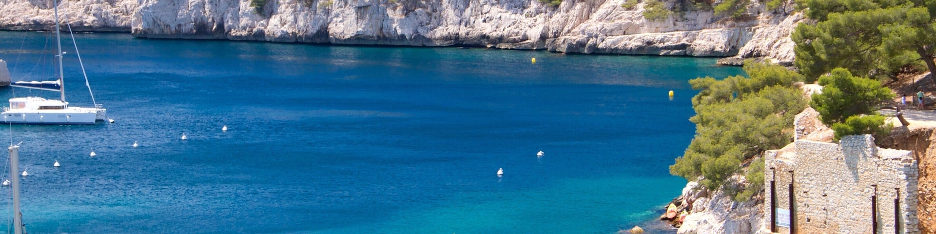 Calanques showing a marina, a river or creek and tranquil scenes