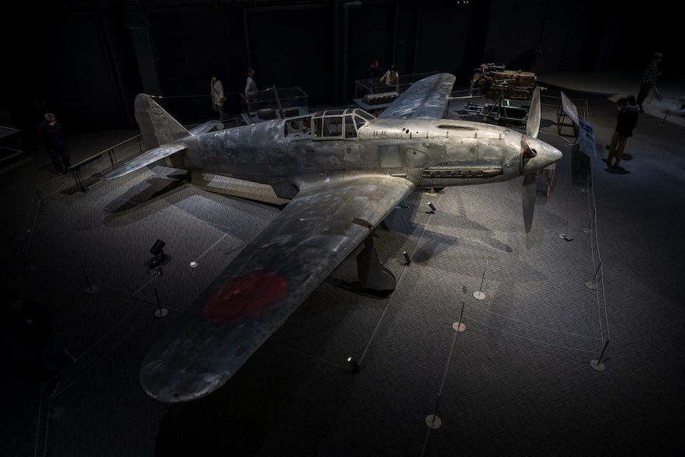 A vintage military aircraft on display in a museum.
