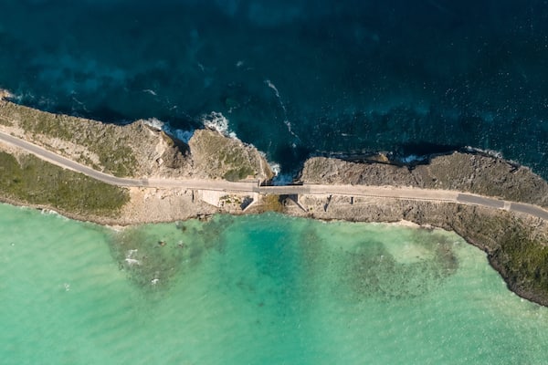 Glass Window Bridge which includes rugged coastline and general coastal views