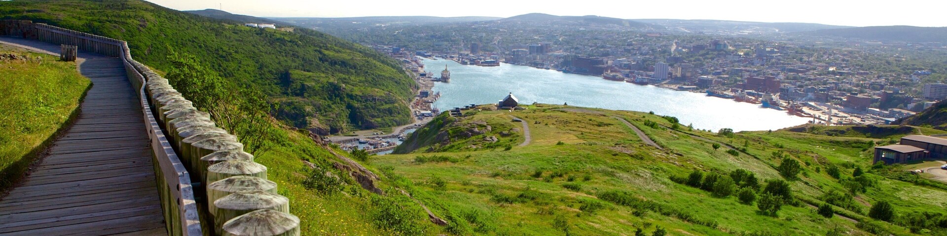Cabot Tower which includes a bay or harbor, landscape views and a city