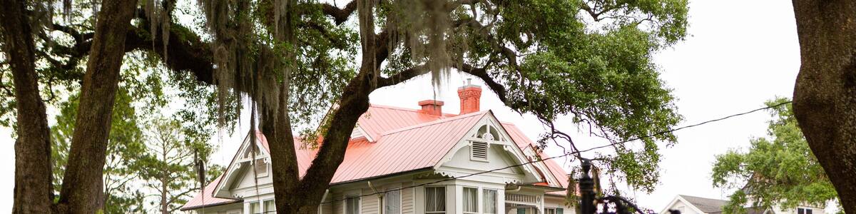 New Iberia featuring signage and a house