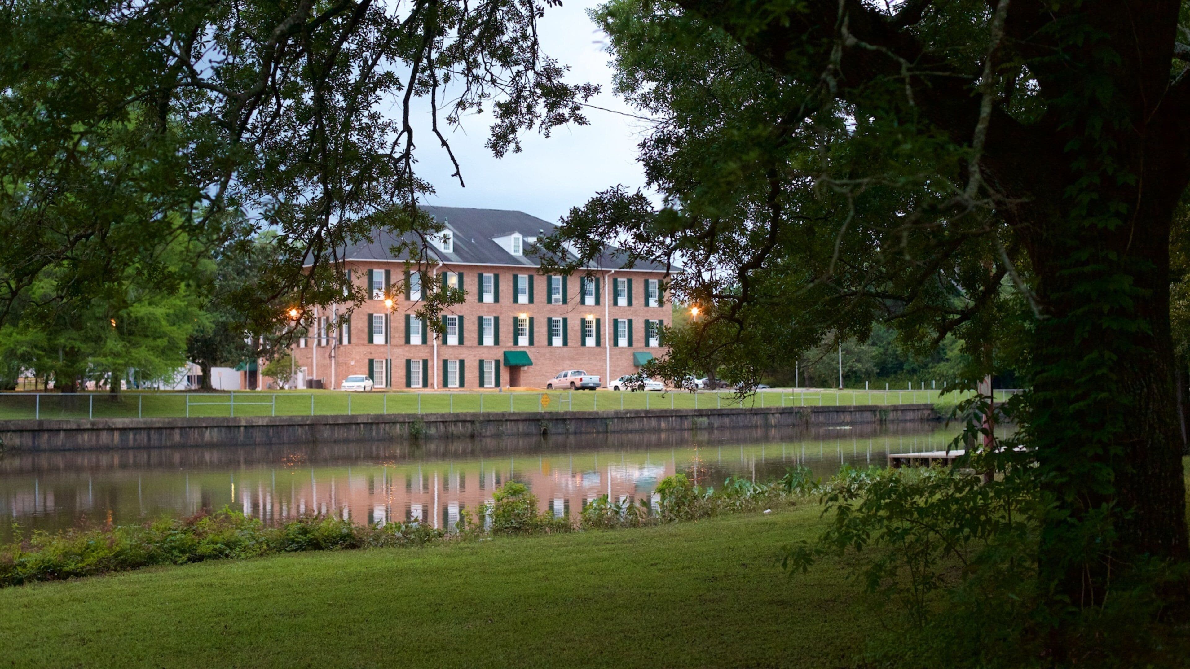 New Iberia which includes a garden and a river or creek