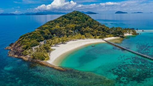 Beautiful tropical island koh Kham, white sand beach with volcanic rocks, near koh Mak, Trat, Thailand