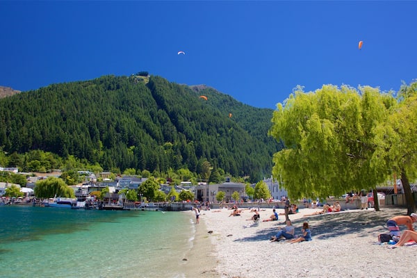 Queenstown Beach featuring a small town or village, a pebble beach and a lake or waterhole
