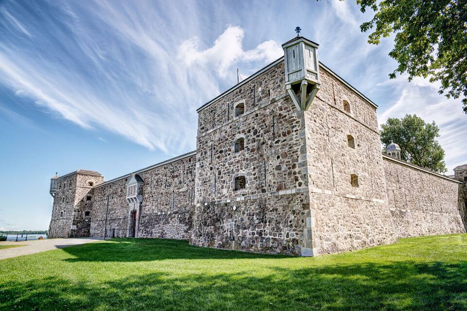 A historic stone building with a tower and a dome.