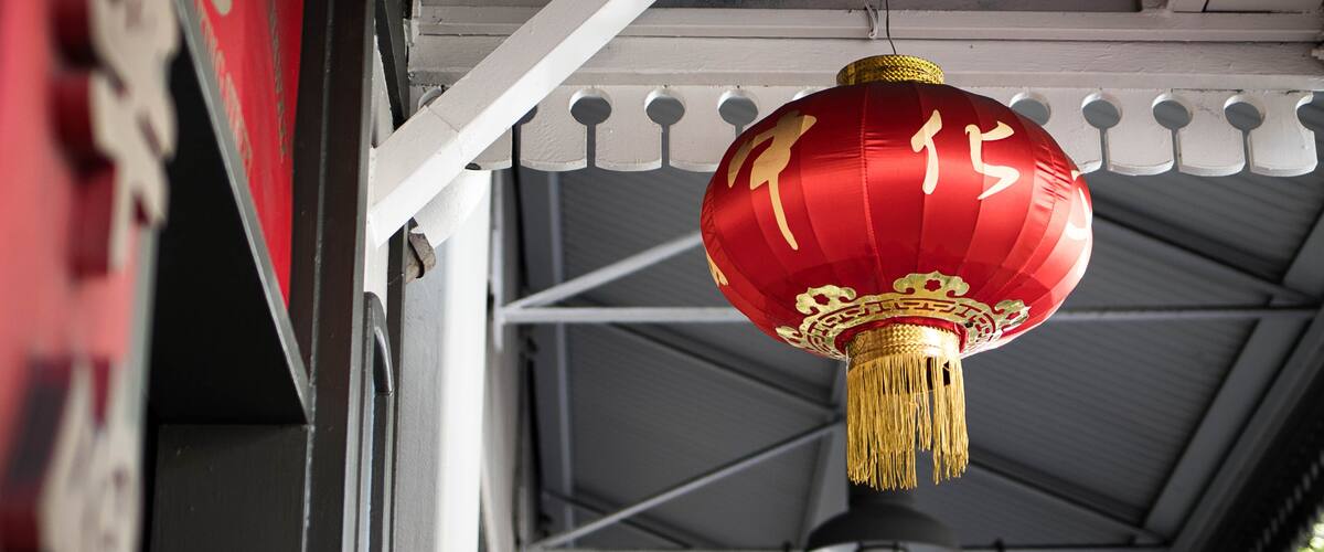 Bright red Chinese lantern hanging in Chinatown, Honolulu, Hawaii, USA