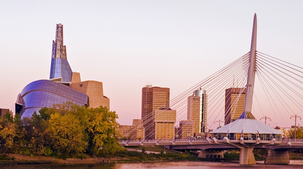 Winnipeg skyline from St. Boniface showing the Red River, Esplanade Riel Bridge and Canadian Museum for Human Rights; Winnipeg, Manitoba, Canada