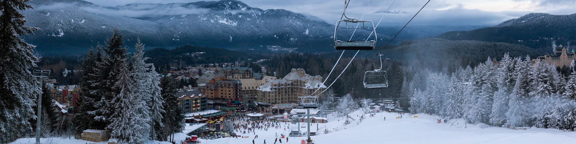 Beautiful view of Whistler Village during a cloudy winter sunset. Touristic Ski Town in British Columbia, Canada.