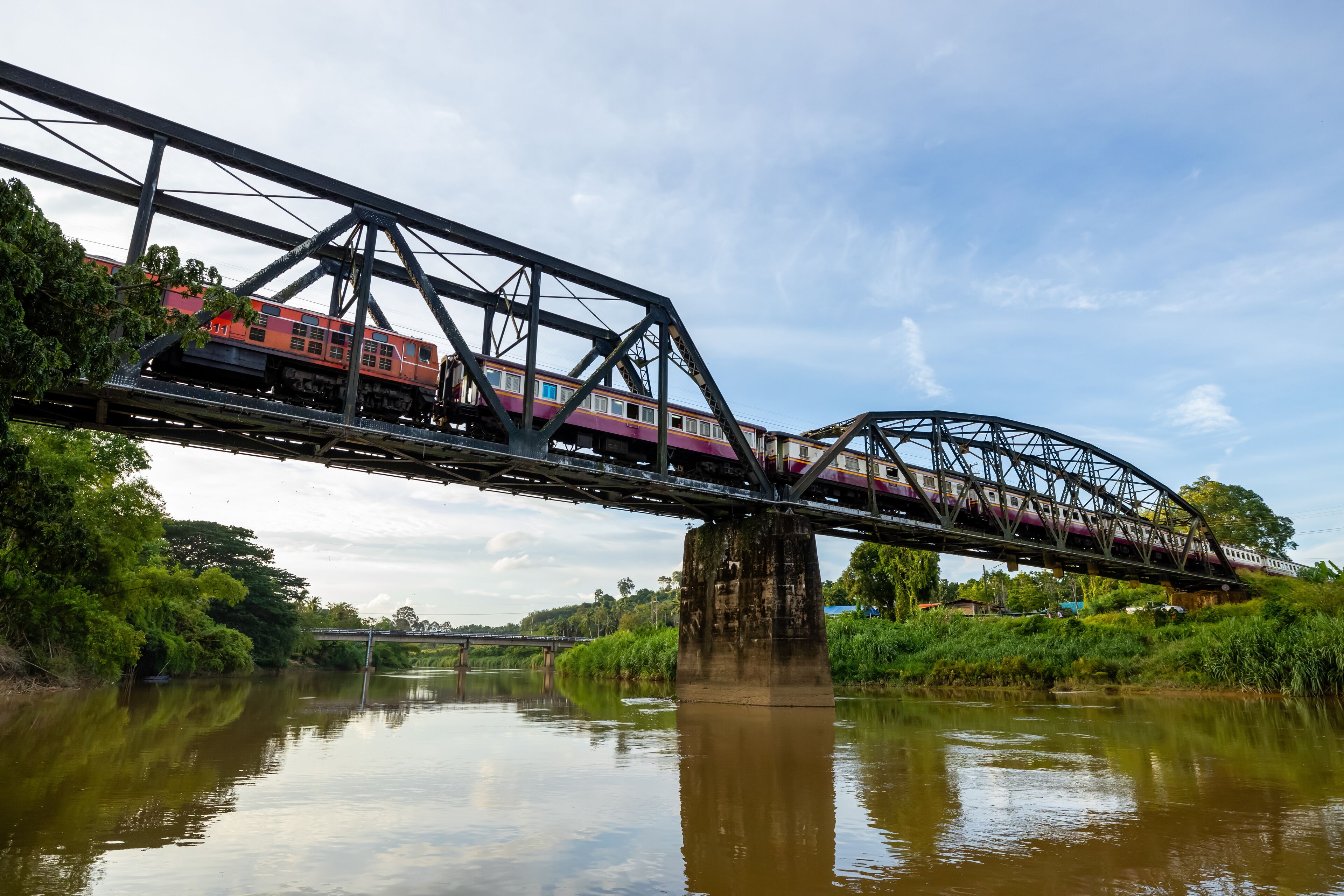 The historic railway bridge crossing the Lang Suan River.