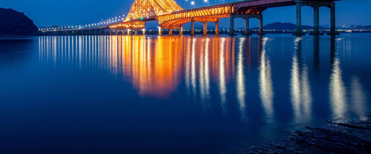 Gangseo-gu, Seoul, South Korea - May 22, 2021: Night view of Banghwa Bridge on Han River with illumination reflection