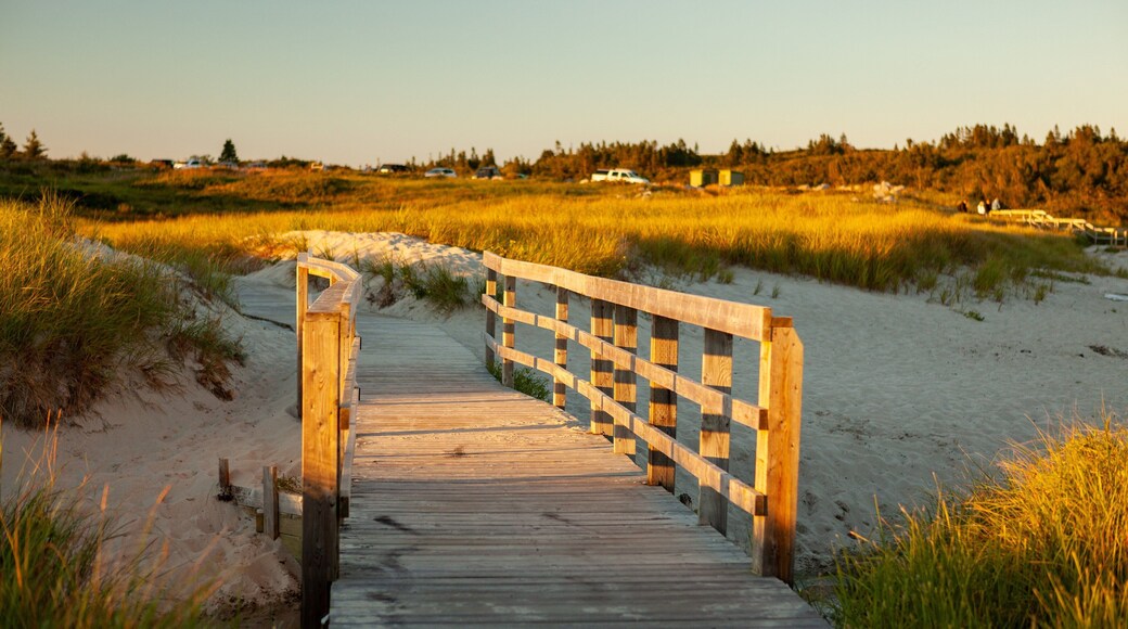 Crystal Crescent Beach featuring a sunset, a sandy beach and a bridge