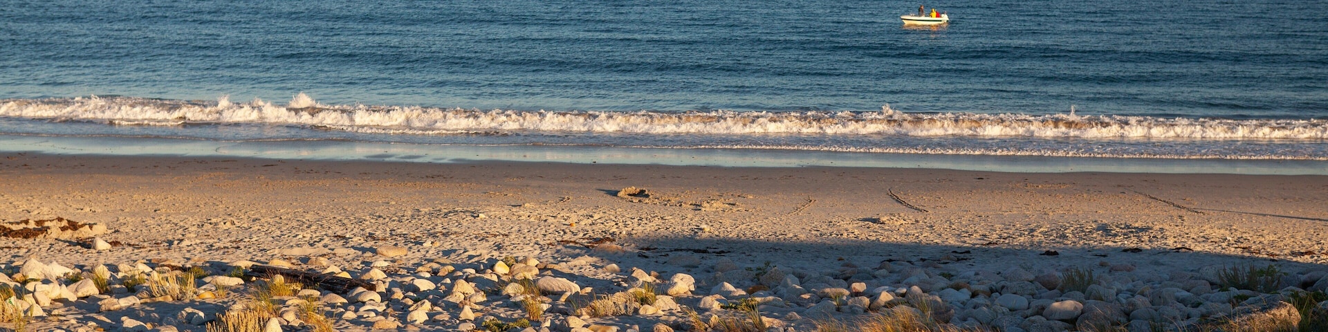 Crystal Crescent Beach which includes general coastal views, a sunset and a sandy beach