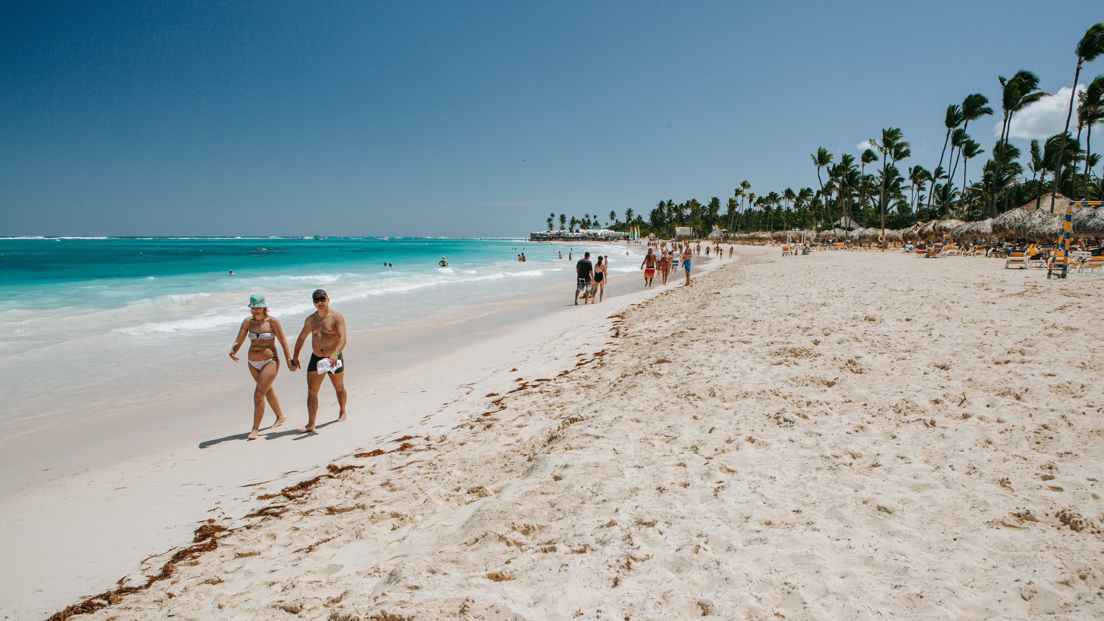 Arena Gorda Beach which includes general coastal views and a sandy beach as well as a couple