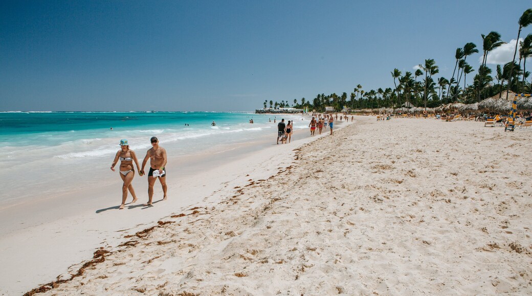 Arena Gorda Beach which includes general coastal views and a sandy beach as well as a couple