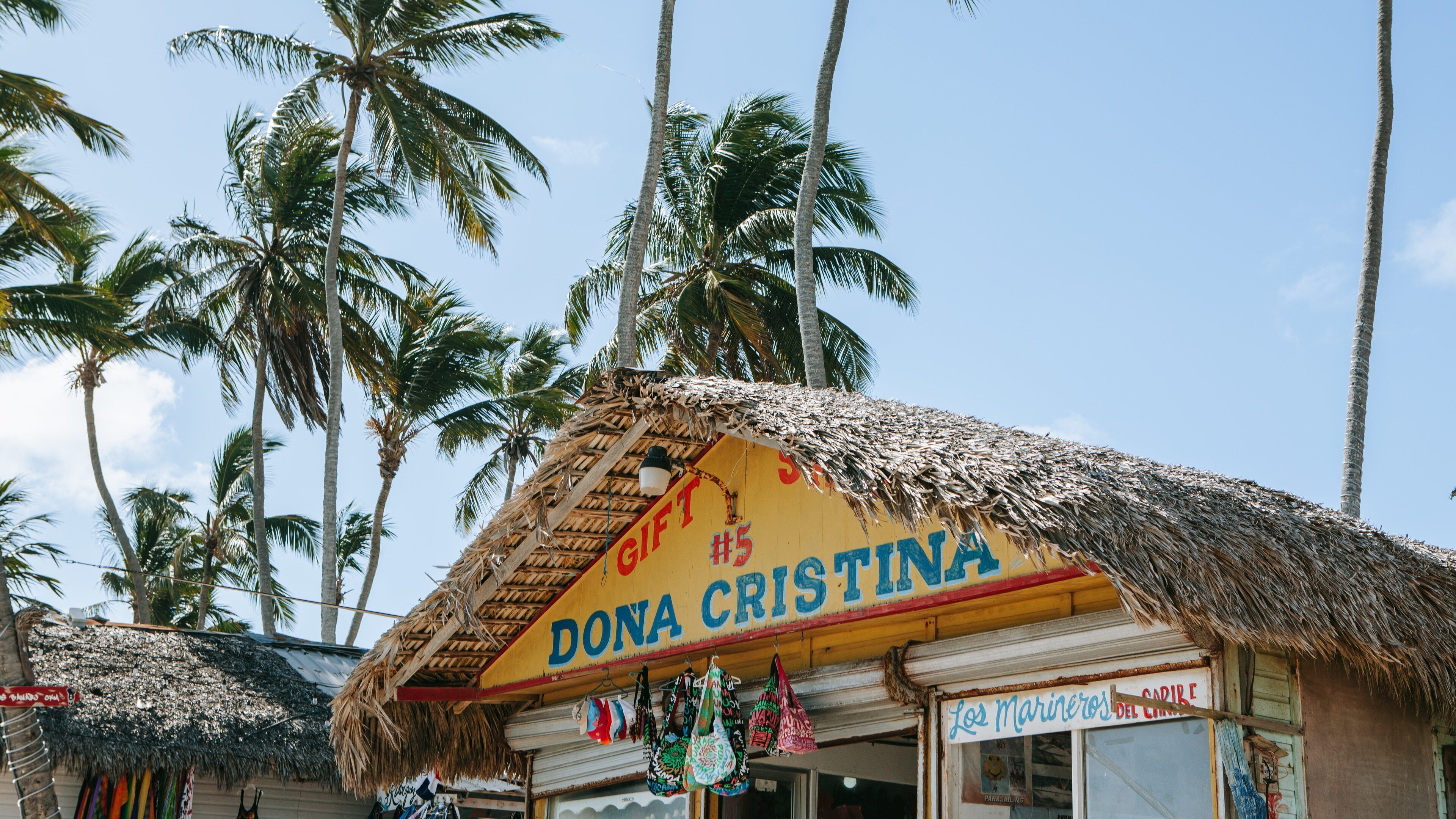 Cortecito Beach showing tropical scenes and signage