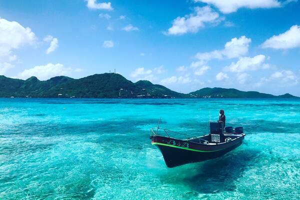 Fishing boats appear to float in the cerulean waters off the coast of Cayo Cangrejo, or Crab Key. These islands, close to the Nicaraguan coast, but governed by Columbia, are some of the only places in the Caribbean that are still untouched by giant cruise ships. Snorkeling the vibrant underwater reefs will work up an appetite, and local vendors are on standby with fresh crab empanadas #BVSBlue