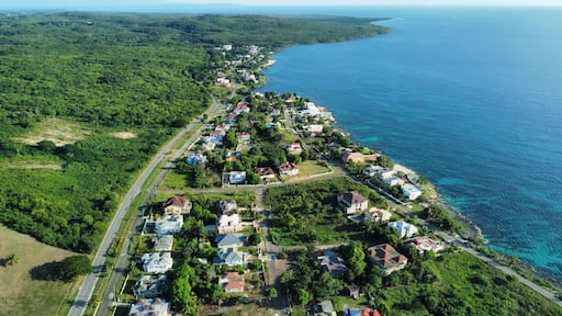 Aerial drone view of the townscape of Whitehouse with a beautiful coast and greenery
