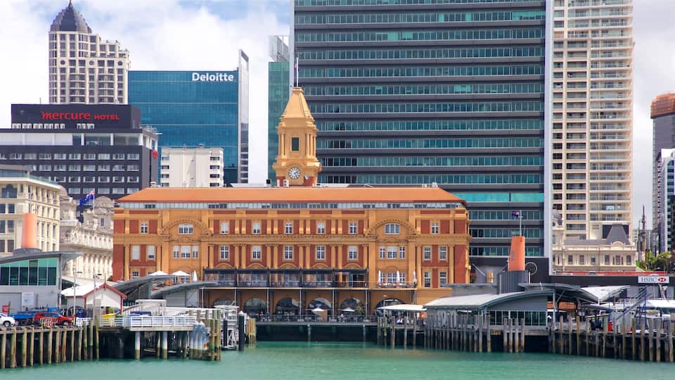 Auckland Ferry Terminal featuring a bay or harbor, a high rise building and heritage elements
