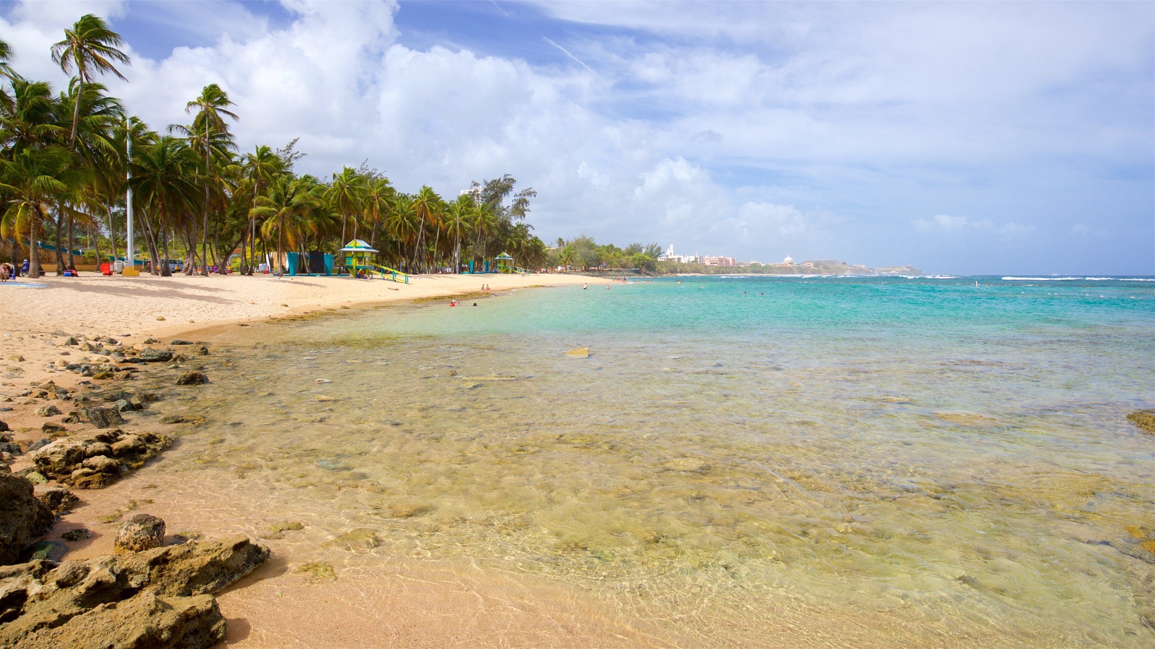 Escambron Beach which includes general coastal views, a beach and tropical scenes