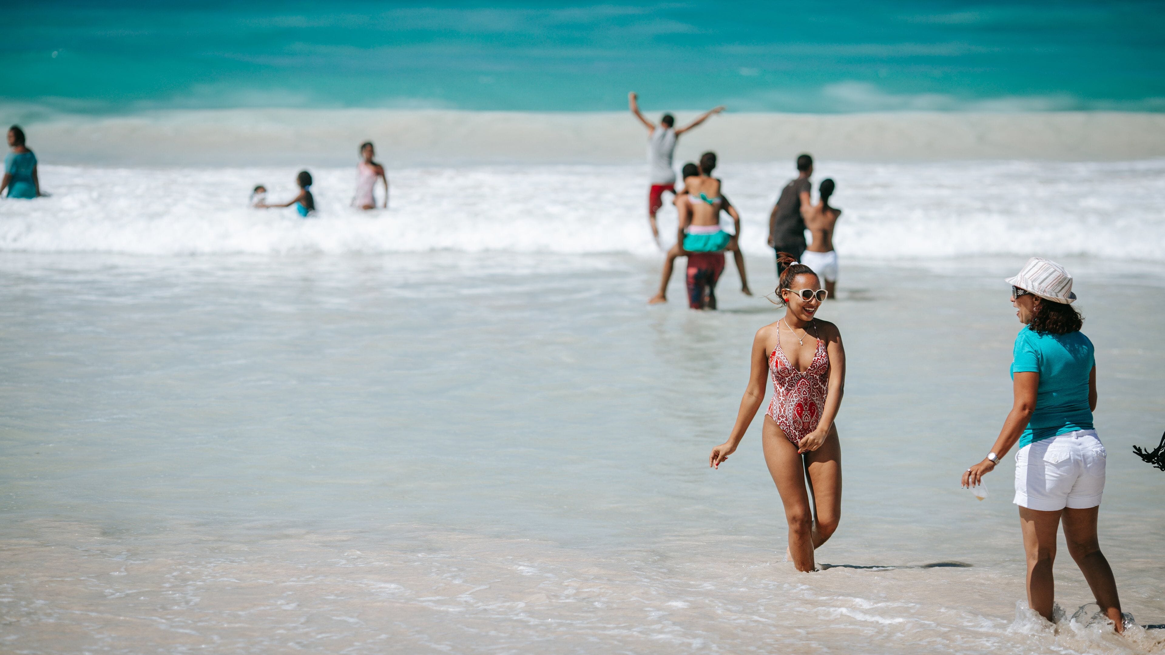 Macao Beach featuring general coastal views and swimming as well as an individual femail