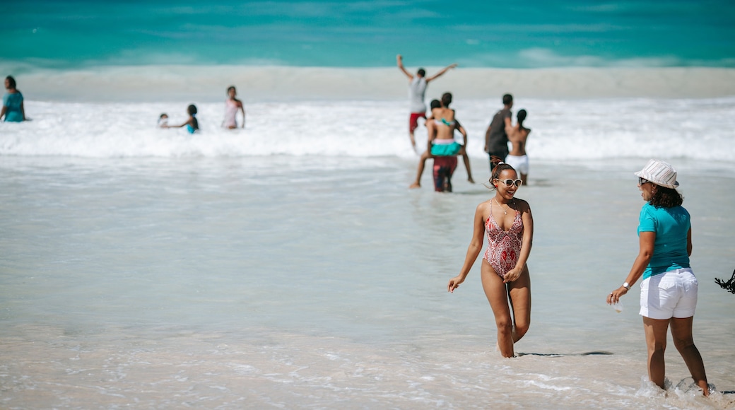 Macao Beach featuring general coastal views and swimming as well as an individual femail