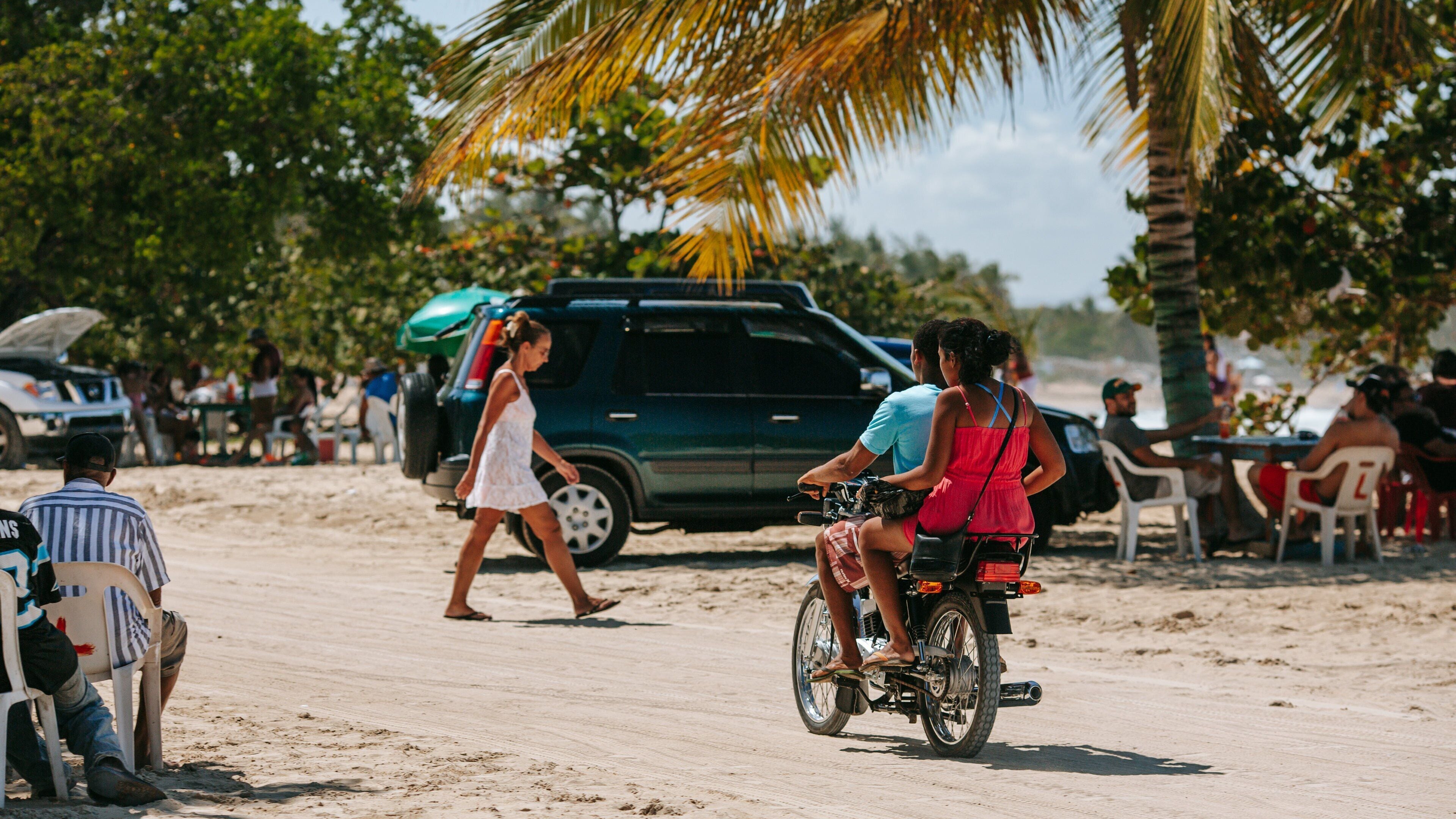 Macao Beach featuring tropical scenes and motorbike riding as well as a couple