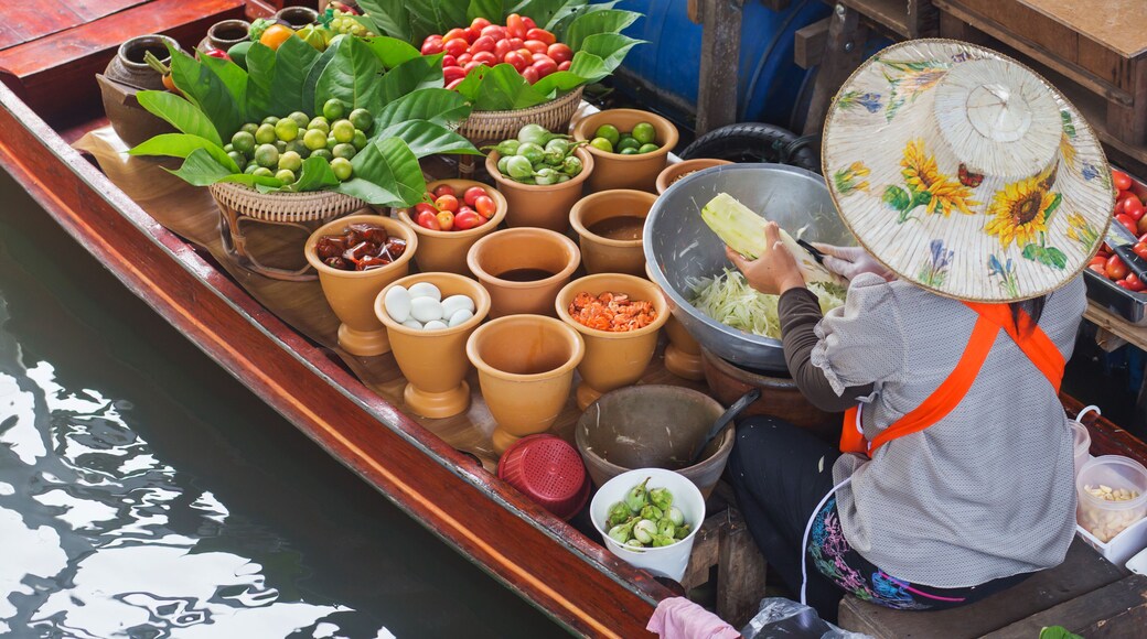 A woman selling Papaya salad Bangkok floating market. ; Shutterstock ID 228468475
